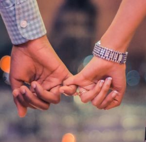 man and woman holding hands